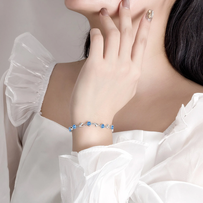 Elegant Silver Heart Charm Bracelet with Sparkling Blue Crystals